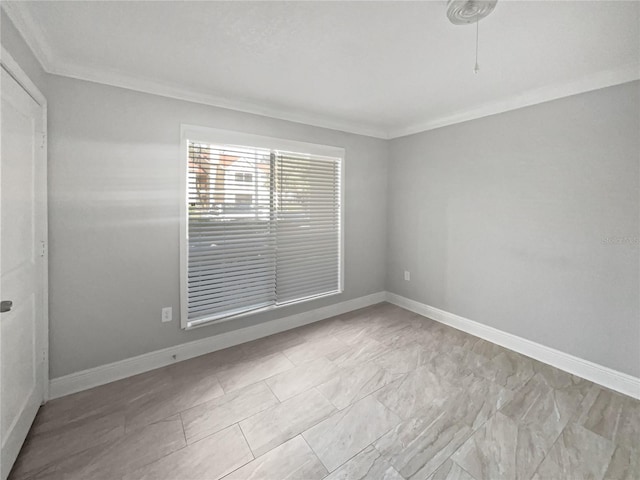 empty room featuring ornamental molding