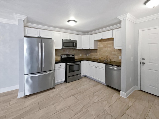 kitchen with white cabinetry, appliances with stainless steel finishes, and sink