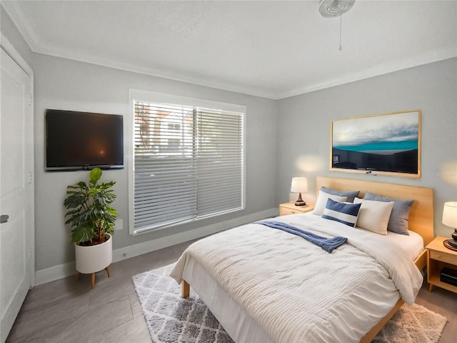 bedroom featuring crown molding