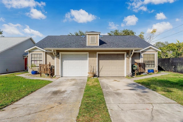 view of front of home featuring a garage and a front lawn