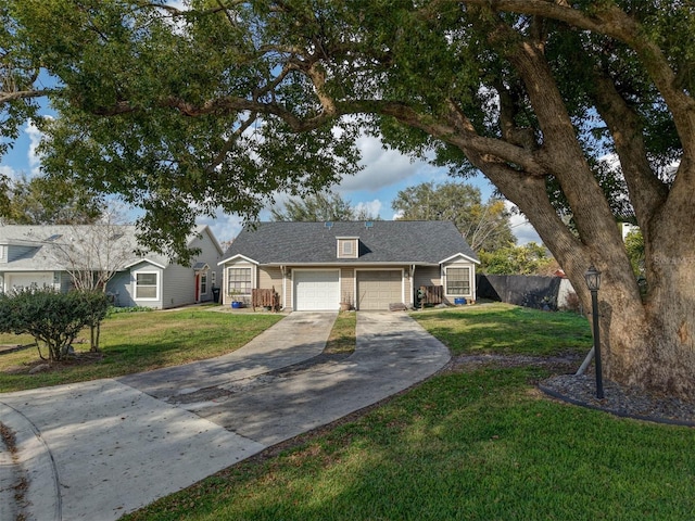 ranch-style home with a garage and a front yard