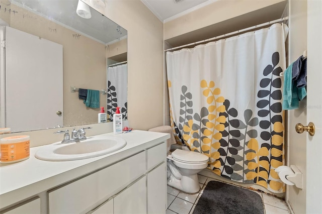 bathroom featuring vanity, tile patterned flooring, ornamental molding, and toilet