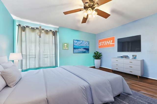 bedroom featuring ceiling fan and dark hardwood / wood-style floors