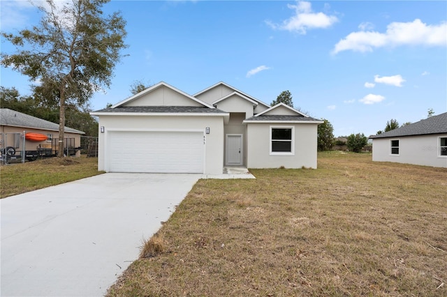 view of front facade featuring a garage and a front lawn