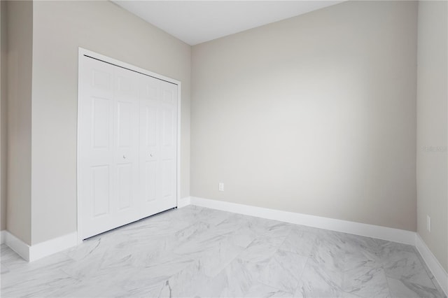 unfurnished bedroom featuring a closet