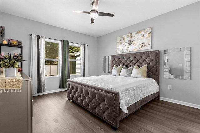 bedroom with dark wood-type flooring and ceiling fan