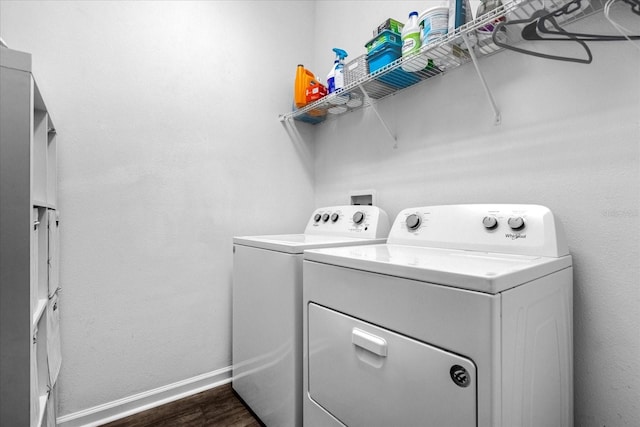 washroom featuring dark wood-type flooring and washer and dryer