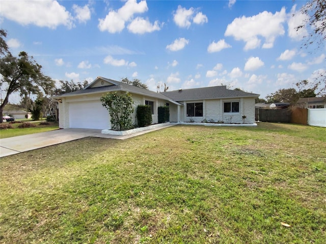 ranch-style house with a garage and a front lawn