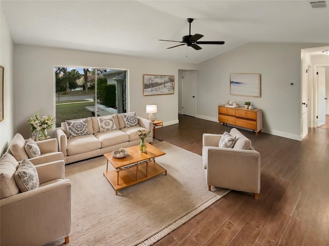 living room with dark wood-type flooring, ceiling fan, and lofted ceiling