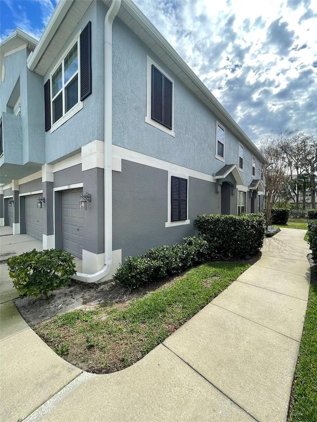 view of side of home with a garage