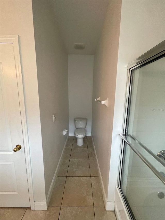 bathroom with tile patterned flooring and toilet