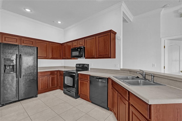 kitchen featuring crown molding, light countertops, a sink, and black appliances