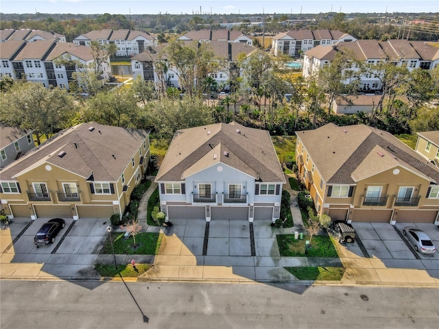 birds eye view of property with a residential view