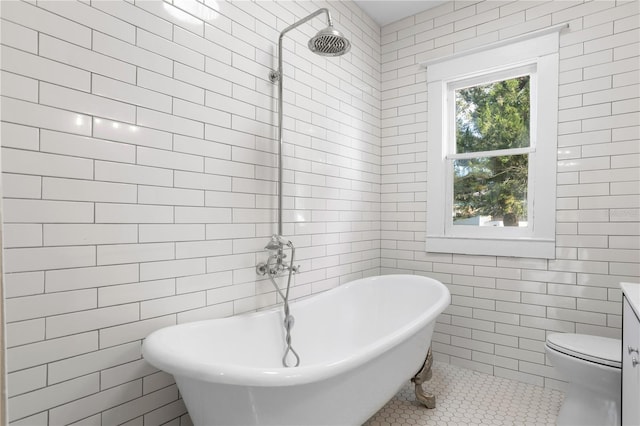 bathroom with tile patterned flooring, separate shower and tub, tile walls, and toilet