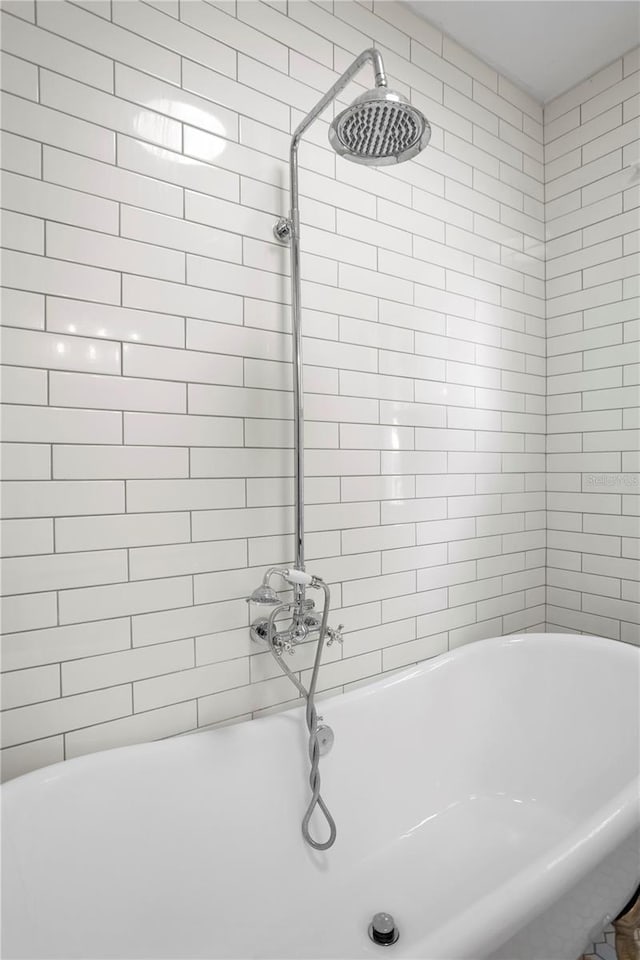 bathroom with tiled shower