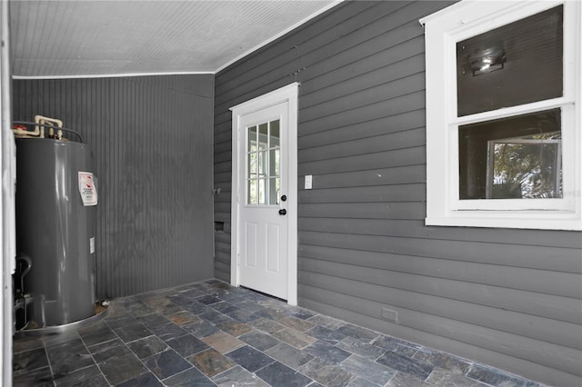 view of exterior entry with water heater