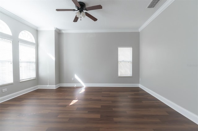 spare room featuring ornamental molding, dark wood-type flooring, and ceiling fan