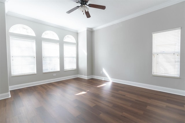 spare room featuring ornamental molding, dark hardwood / wood-style floors, and ceiling fan