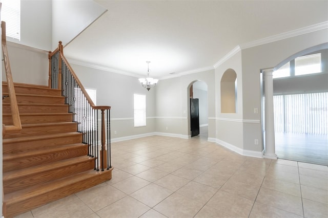 interior space featuring light tile patterned flooring and ornamental molding