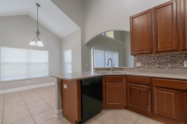 kitchen featuring black dishwasher, sink, decorative backsplash, hanging light fixtures, and light tile patterned floors