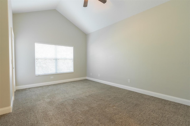 carpeted empty room with vaulted ceiling and ceiling fan