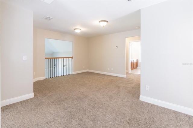 unfurnished room with light colored carpet