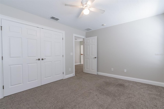 unfurnished bedroom featuring ceiling fan, carpet floors, and a closet