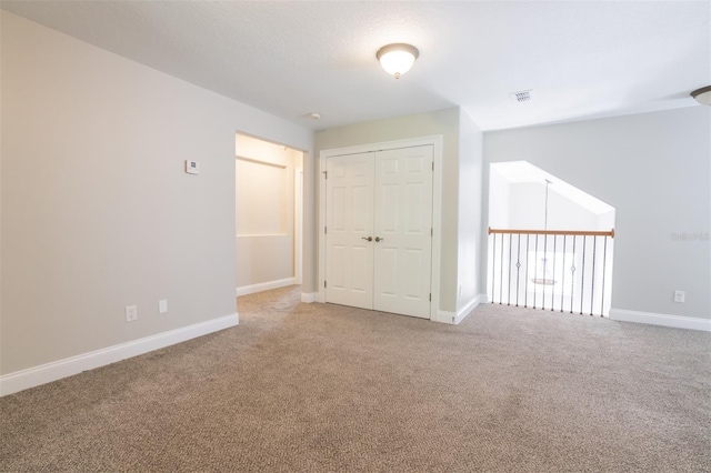 unfurnished room featuring carpet floors