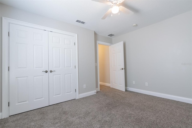 unfurnished bedroom with a closet, ceiling fan, and carpet