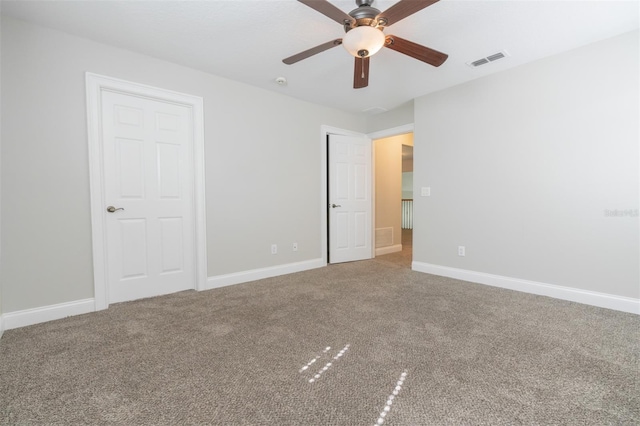 unfurnished bedroom with ceiling fan and carpet flooring