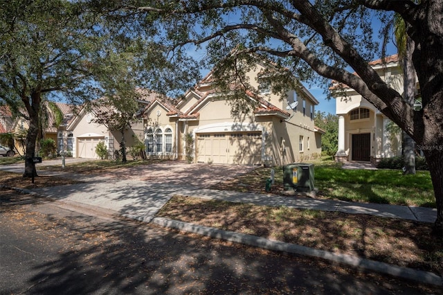 view of front of property with a garage