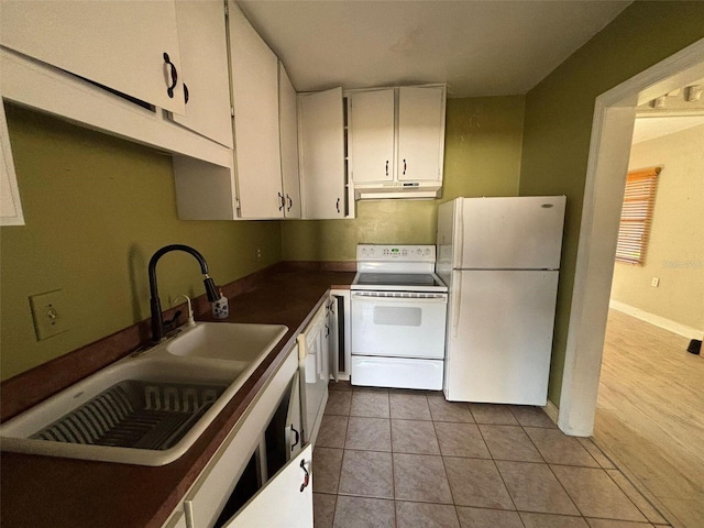 kitchen featuring white cabinetry, white appliances, sink, and light tile patterned floors