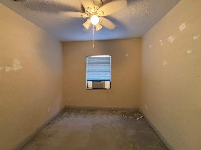 carpeted empty room with cooling unit, ceiling fan, and a textured ceiling