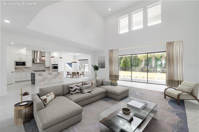 living room with a towering ceiling