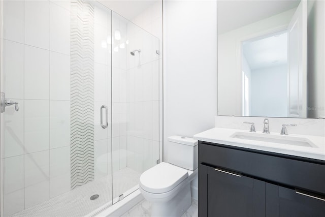 bathroom with vanity, an enclosed shower, and toilet