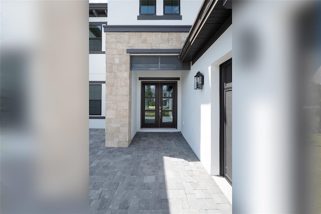 doorway to property featuring french doors