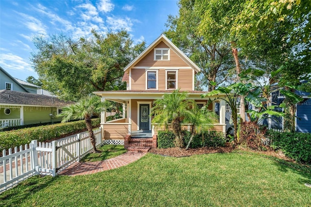 view of front facade featuring a front lawn and a porch