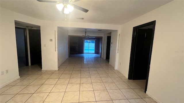 hallway with light tile patterned floors