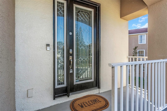 property entrance with a balcony