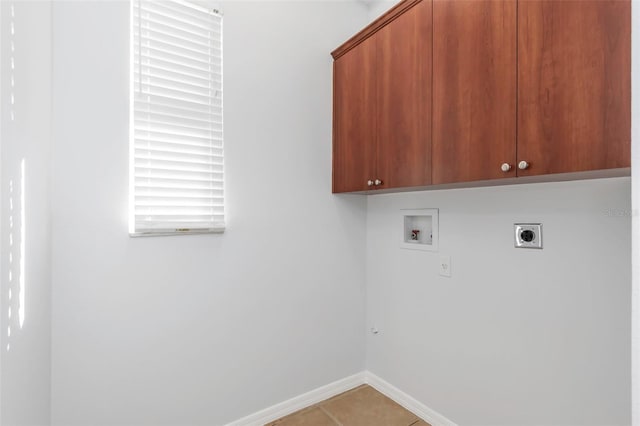 washroom featuring cabinets, washer hookup, hookup for an electric dryer, and tile patterned floors