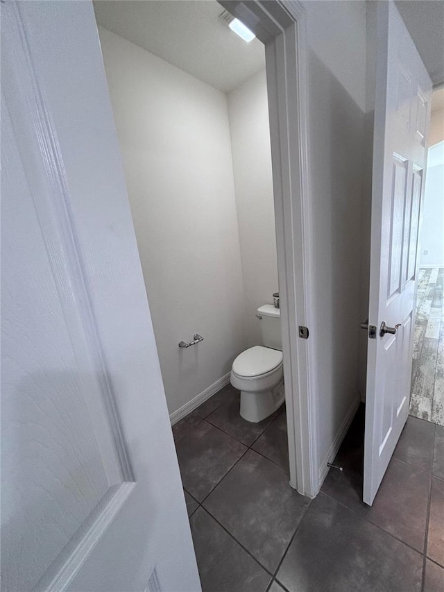 bathroom with tile patterned floors and toilet