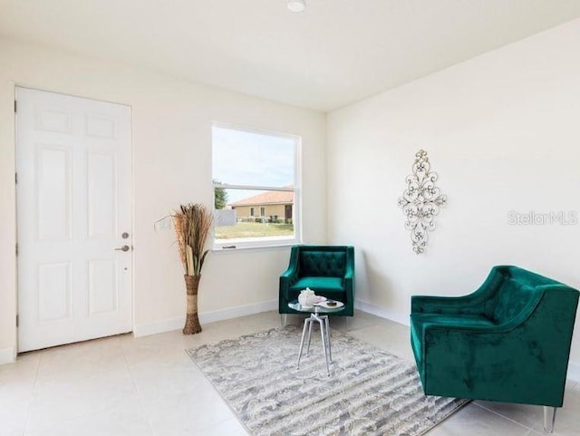 living area featuring tile patterned floors