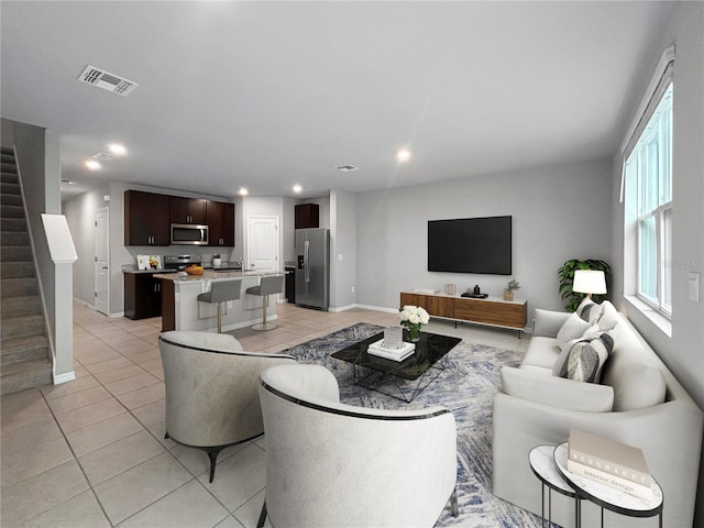 living room featuring light tile patterned flooring