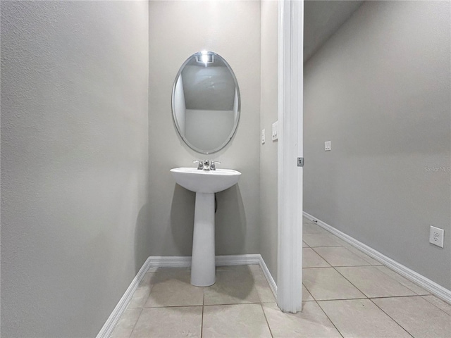 bathroom with tile patterned floors