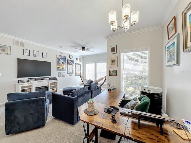 carpeted living room with ornamental molding and ceiling fan with notable chandelier