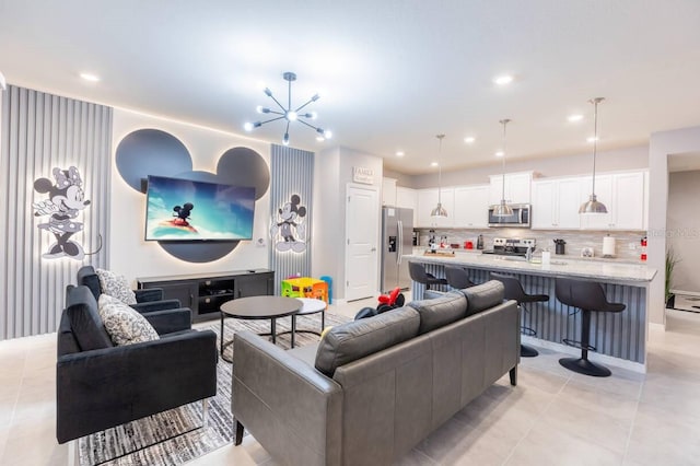 living room with light tile patterned flooring and a chandelier