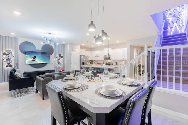 tiled dining area featuring an inviting chandelier