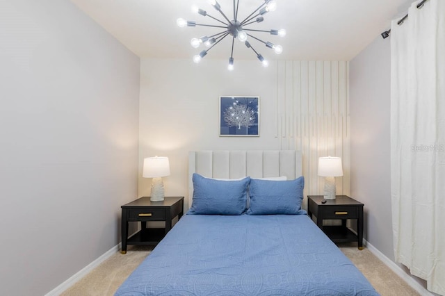 bedroom featuring light colored carpet and a chandelier