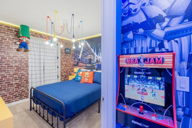 bedroom with carpet and brick wall