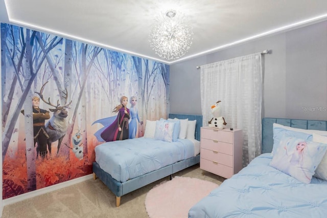 carpeted bedroom featuring a notable chandelier